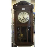 Mid 20th Century oak cased, three train wall clock. (B.P. 24% incl.