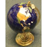 A modern ceramic and brass table globe. (B.P. 24% incl.