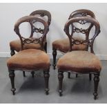 SET OF FOUR LATE VICTORIAN MAHOGANY SPOON BACKED DINING CHAIRS with moulded, pierced decoration,