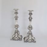 A pair of Louis XV German rococo silver candlesticks with engraved and repousse scrolls silver