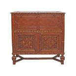 A mid 20th century Dutch style carved chestnut and parquetry pattern veneer drinks cabinet with