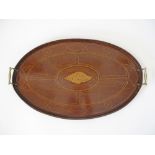 An English early 20th century mahogany and marquetry oval tray with brass handles. 60X39cm