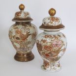 A pair of Oriental mid 20th century porcelain jars and covers of baluster form, painted in enamels