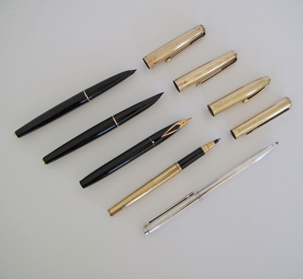 A collection of five pens comprising three fountain pens with gold cups, a gold ball pen and a - Image 2 of 11