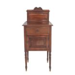 A French style mahogany bedside table / commode c19th century, with a carved pediment, a drawer