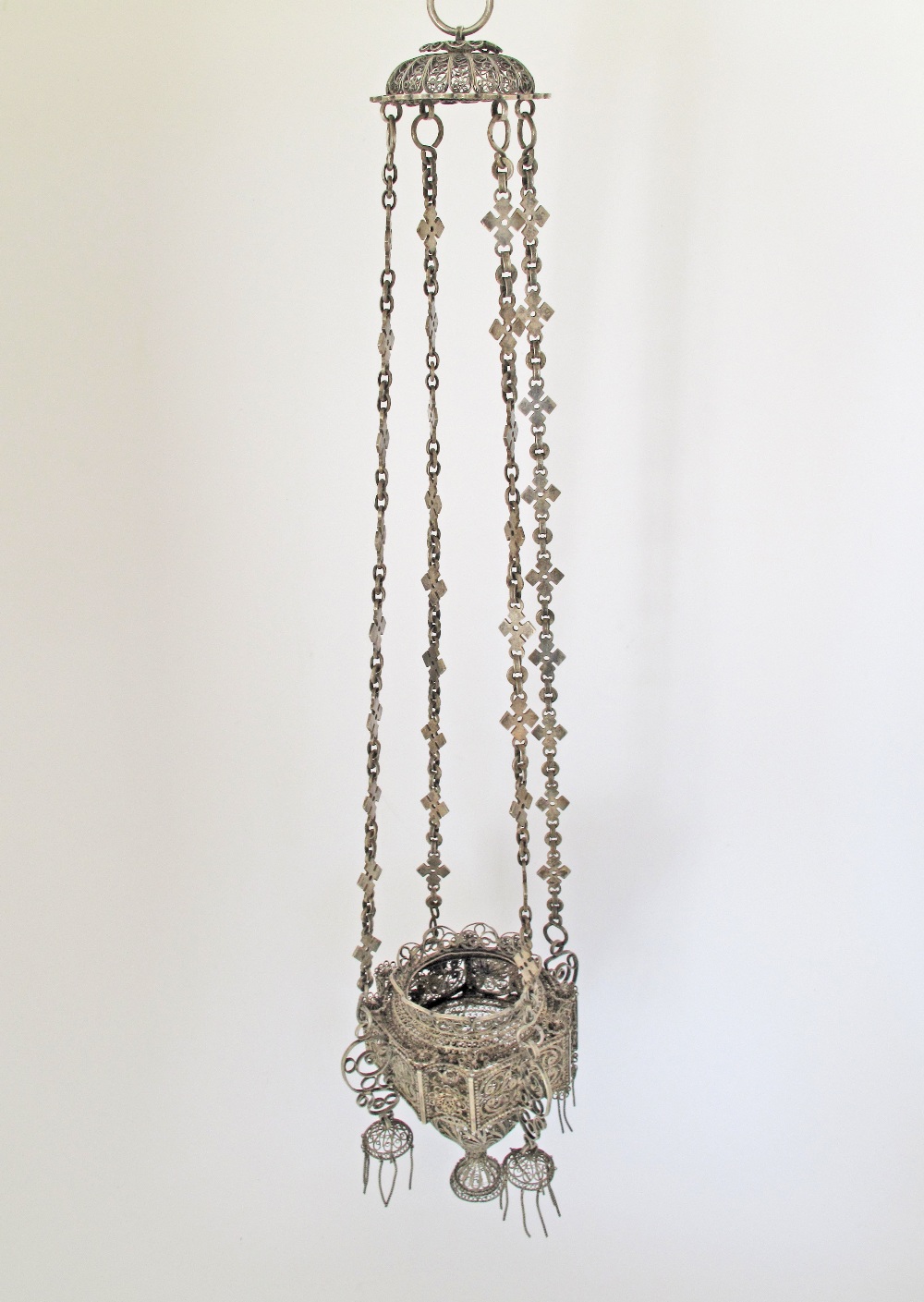 An Orthodox silver votive hanging lamp with filigree decoration. C18th / 19th century. H60cm,