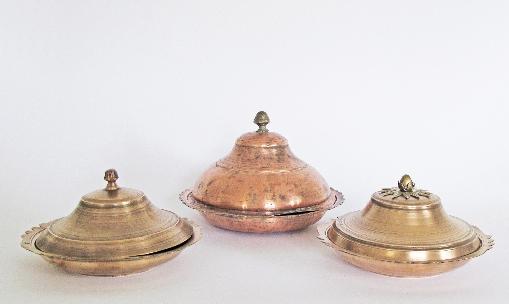 A collection of Turkish copper & brass dishes & covers, the largest W25cm. (6)