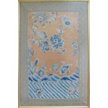 A fine Chinese embroidery in blue colours of flowers and waves. Framed and glazed. 52X79cm.