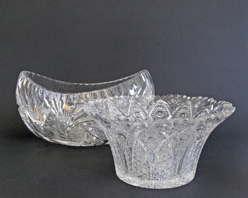 Two Bohemian finely cut crystal center pieces. A boat shaped vase W28cm, and a round trumpet