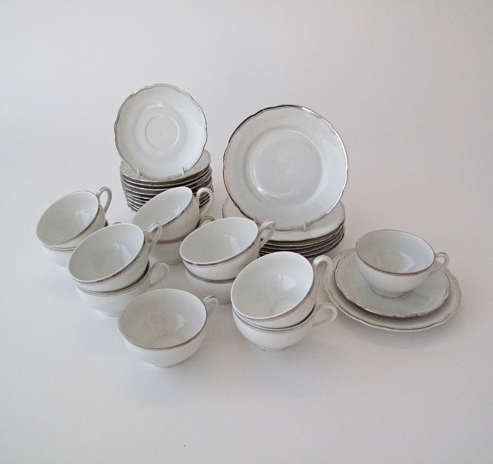 A set of 12 vintage "MZ"Czechoslovakian white porcelain tea cups and saucers with silver trimming,