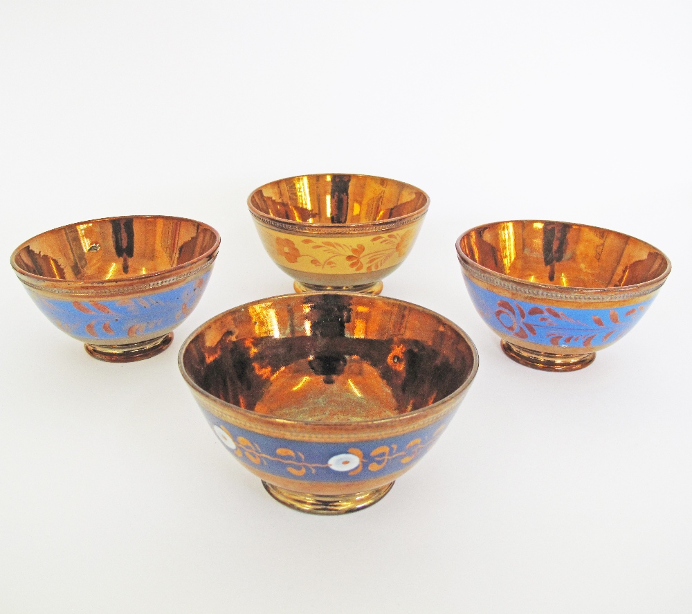 A collection of English copper lustre ceramic bowls W14-15cm. (4)