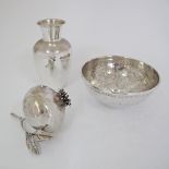 A collection of three silver items, a vase 87g, H10cm, a bowl 107g, W10.3cm, and a pomegranate