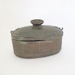 A Persian / Islamic oval copper cauldron and cover the body engraved with alternating panels of