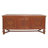 A mid 20th century Dutch style carved chestnut three door dresser, with parquetry pattern top, of