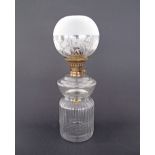 A vintage clear glass oil lamp H37cm with an engraved glass shade W14cm.