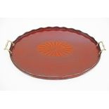 An English early 20th century mahogany and marquetry oval tray with brass handles. 60X39cm