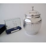 A silver filigree ship in a glass cover, together with a silver plated ice bucket H24cm. (4)