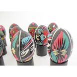 A collection of 11 Russian hand painted Easter eggs, W7cm.
