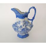 An English flow blue ceramic pitcher c19th century. H30cm