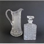 A finely cut square glass decanter with stopper H22cm and a finely cut crystal pitcher H29cm