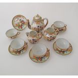 A part Japanese vintage eggshell white porcelain handpainted tea service, comprising a tea pot