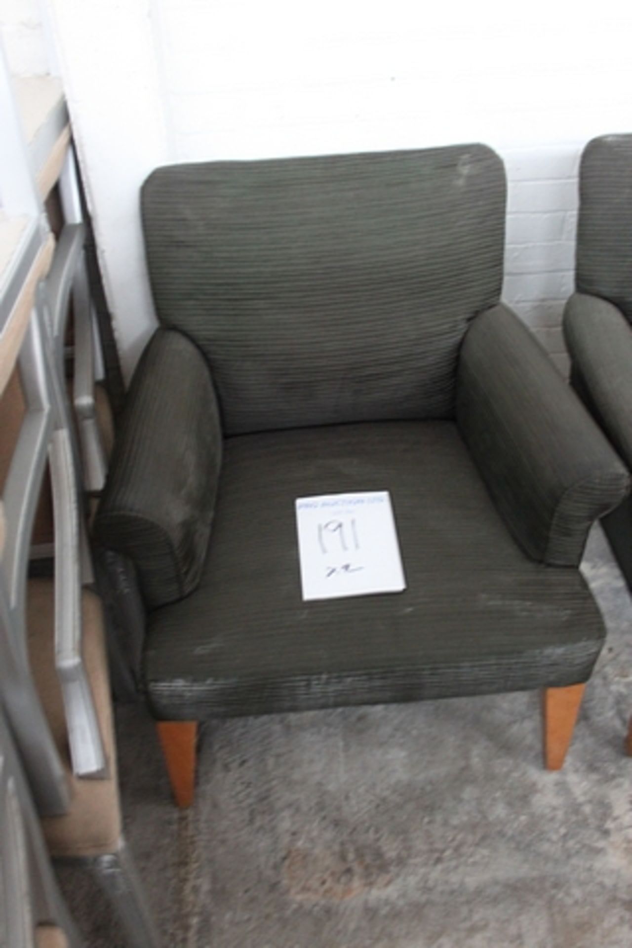 A pair of upholstered dark green arm chairs 540mm x 900mm