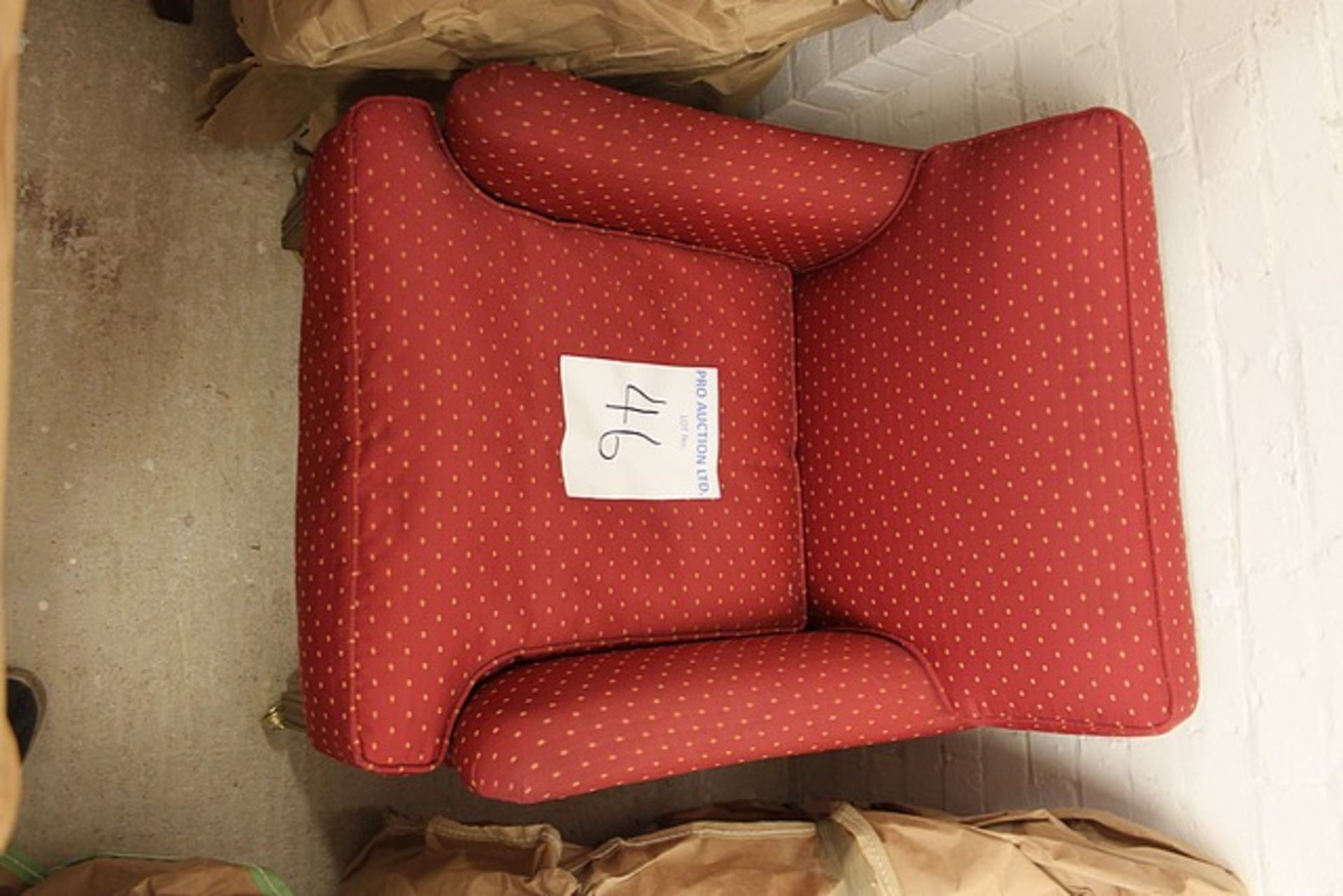 Upholstered red pattern repeating armchair square back fixed cushion and loose pad seat mounted on