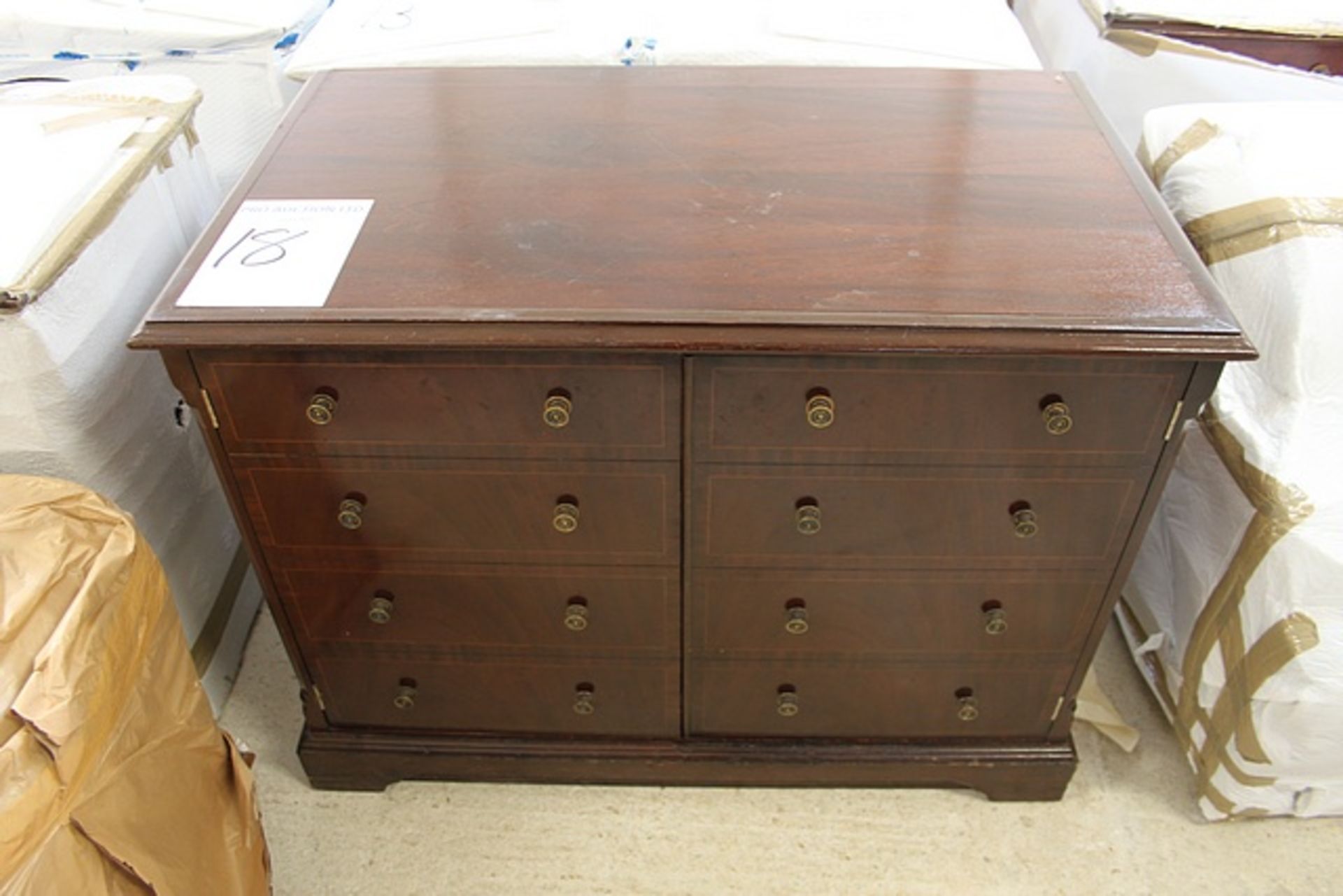 Mahogany two door (faux four drawer panel) cabinet on plinth base fitted internally with