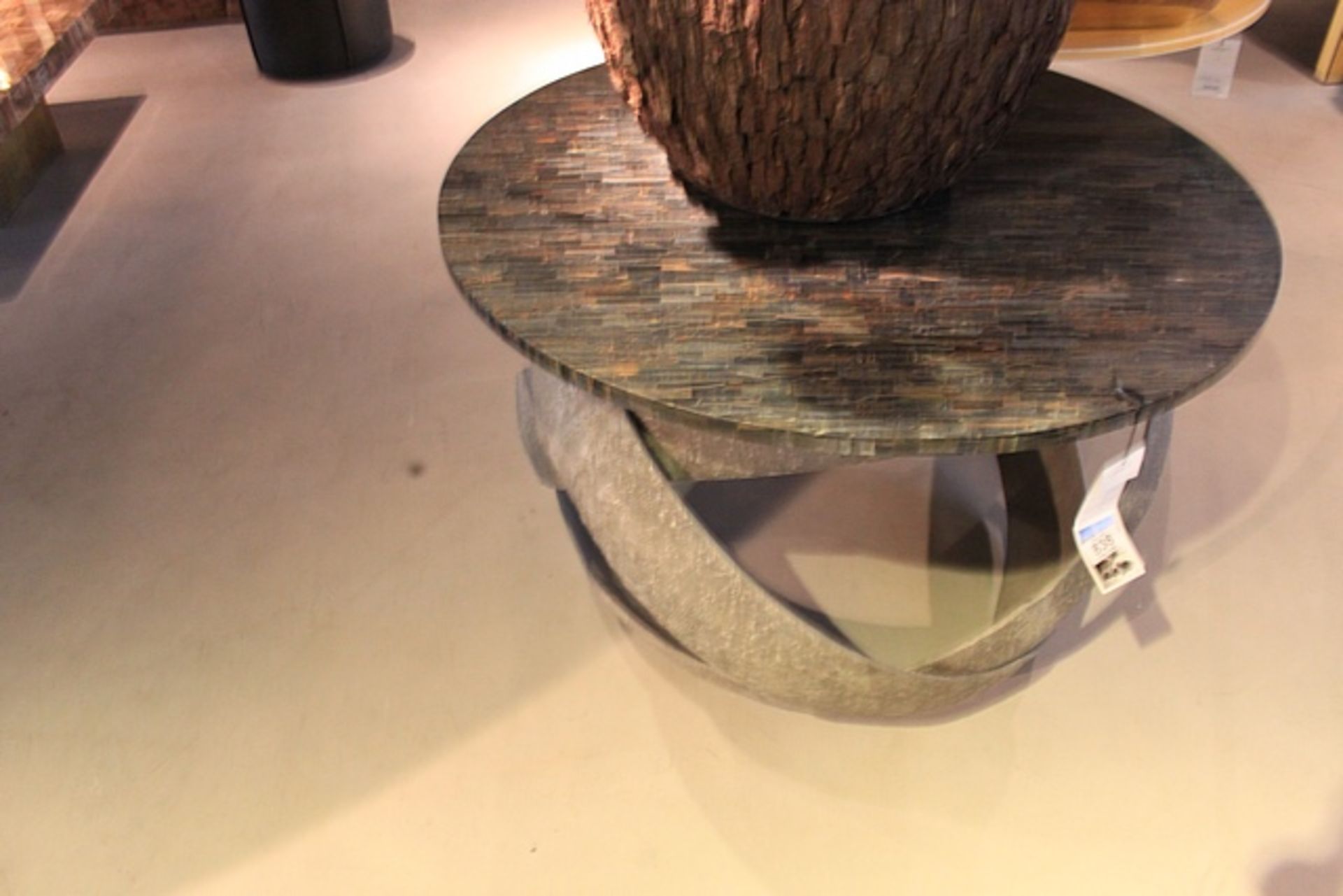 Side Table Tigo Tiger circular low level table featuring a blue tiger’s eye stone top poised upon