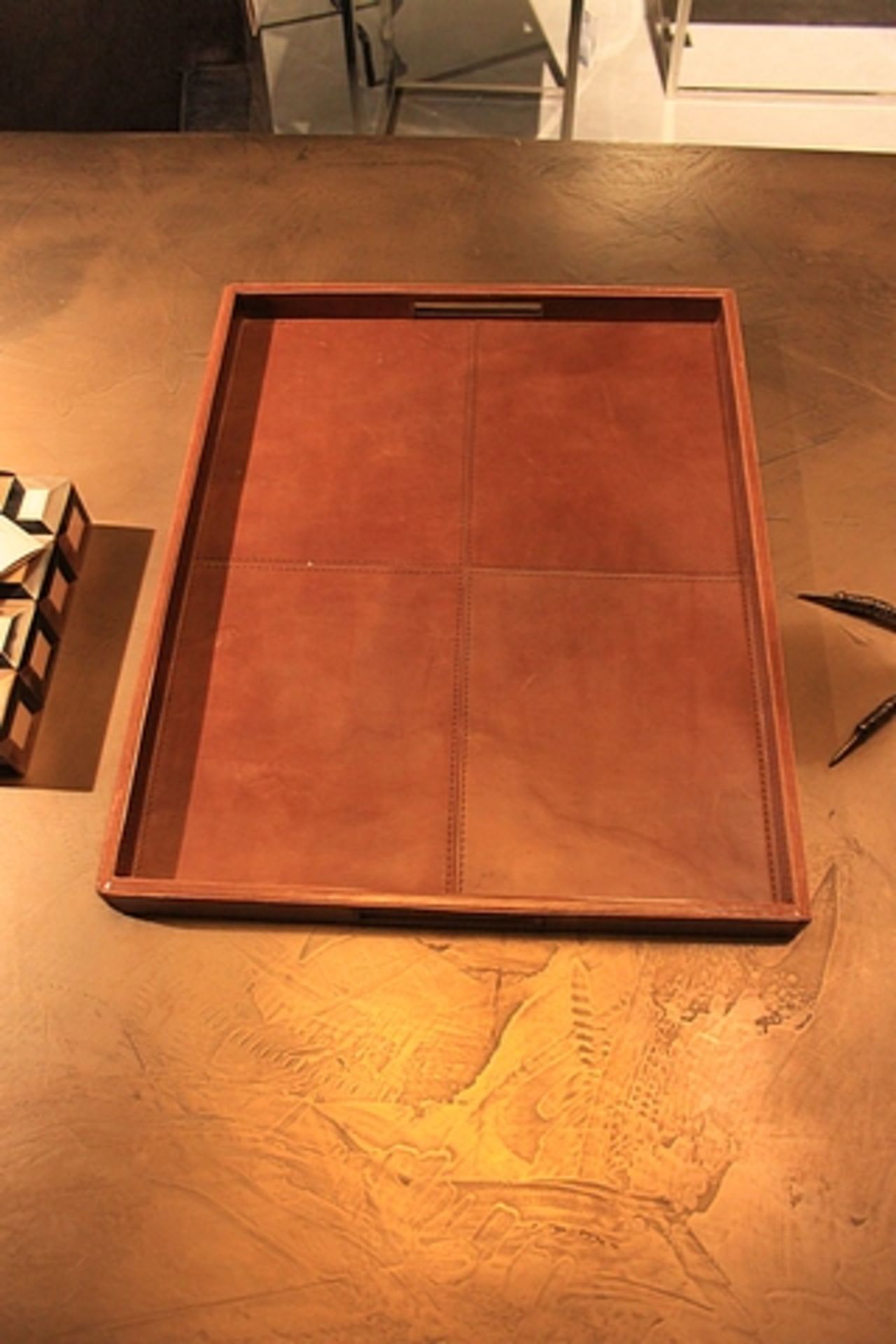Tray Teller the tray structured into a simple design and upholstered in antique tan leather
