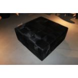 Pouf Squares is classically contemporary and oversized for ultimate lounging. The black cow hide