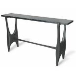 A Console with graphically designed legs reminiscent of the Scissors effect in a Medium Top, Dark