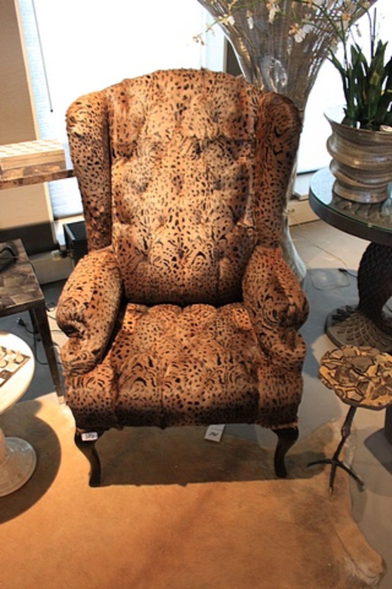 Chair Gotic Berjer a take on the classic wing back arm chair upholstered in a brown leopard