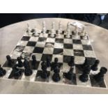 Chess sets bone chess pieces. A regal series of chessmen that are created by hand by craftsmen who