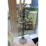 Tea Light Chandelier Eifel provides decorative candlelight illumination and features 9 votives.