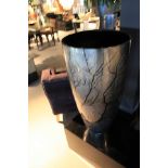 Round Planter Dark Silverleaf Senza Ramo Vase is medium sized, and has a conical shape that is