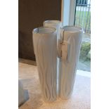 Glass Vase Crafty displays medium slender proportions and a wraparound cut out detail silhouette for