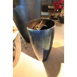 Round Planter Silverleaf is a medium sized sapphire Senza Ramo vase that showcases a sleek conical