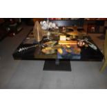 Table top with block pattern is decorated with an eye-catching patchwork design in tabac black