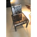 A luxurious Helsinki Platinum Cow Leather Dining Chair in Antique Black and Rusty Platinum, a