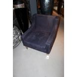 Chair Classic Leather Flotter is upholstered in richly decadent purple and accentuated with