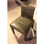 Dining Chair featuring Helsinki upholstery in rusty grey cow leather, with square seat and tilted