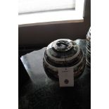 Box Stripes Round ornamental orb shaped vessel featuring black, brown, shell and white resin