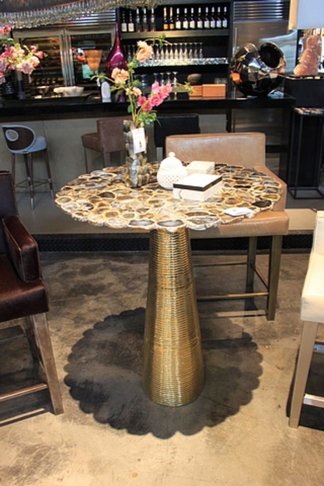 Bar table Rotate a polished black/natural agate round table with nickel-brass base variations in the