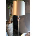 Floor Lamp Amatist  a large pinched shiny brass table lamp featuring an amethyst crystal ball sphere