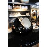 Bowl infinity an ultramodern statement piece hand carved bowl with black lacquer and sliverleaf