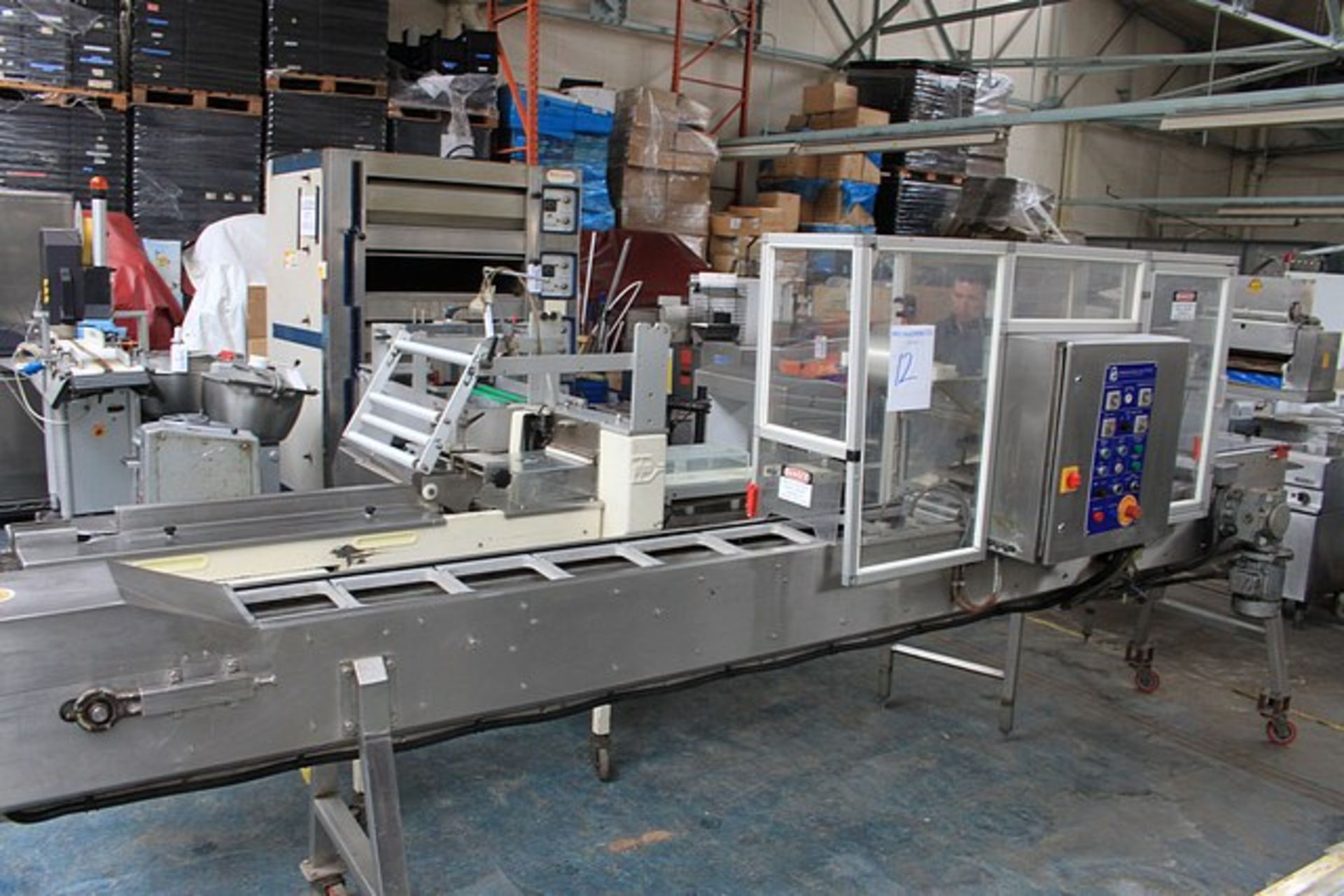 Packaging Automation PA236 hot foil tray sealing machine applies film lid to tray tooling set for