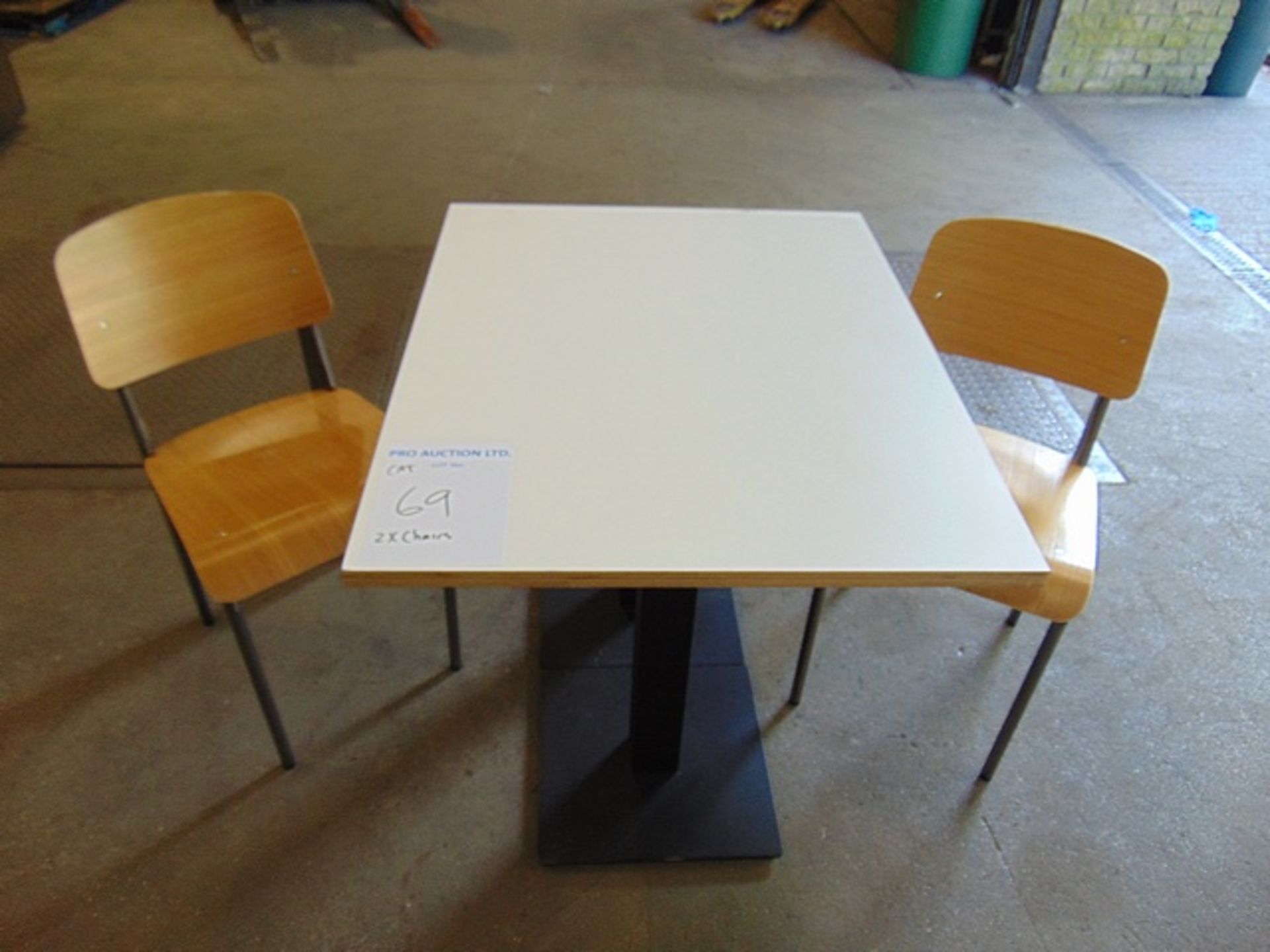 Wooden dinning table with cast metal single base 950mm x 760mm x 760mm complete with 2 x dinning