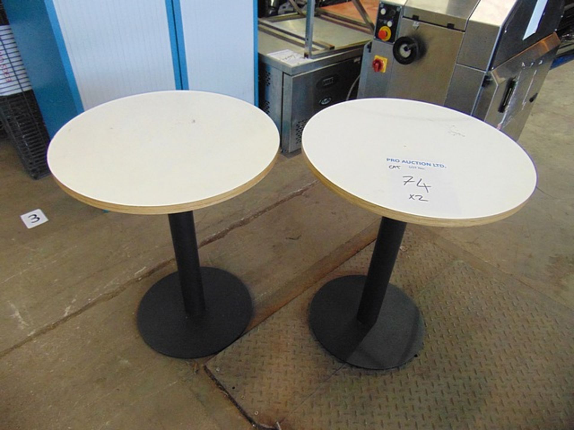 2 x wooden round dinning tables with cast metal single base 600mm x 760mm