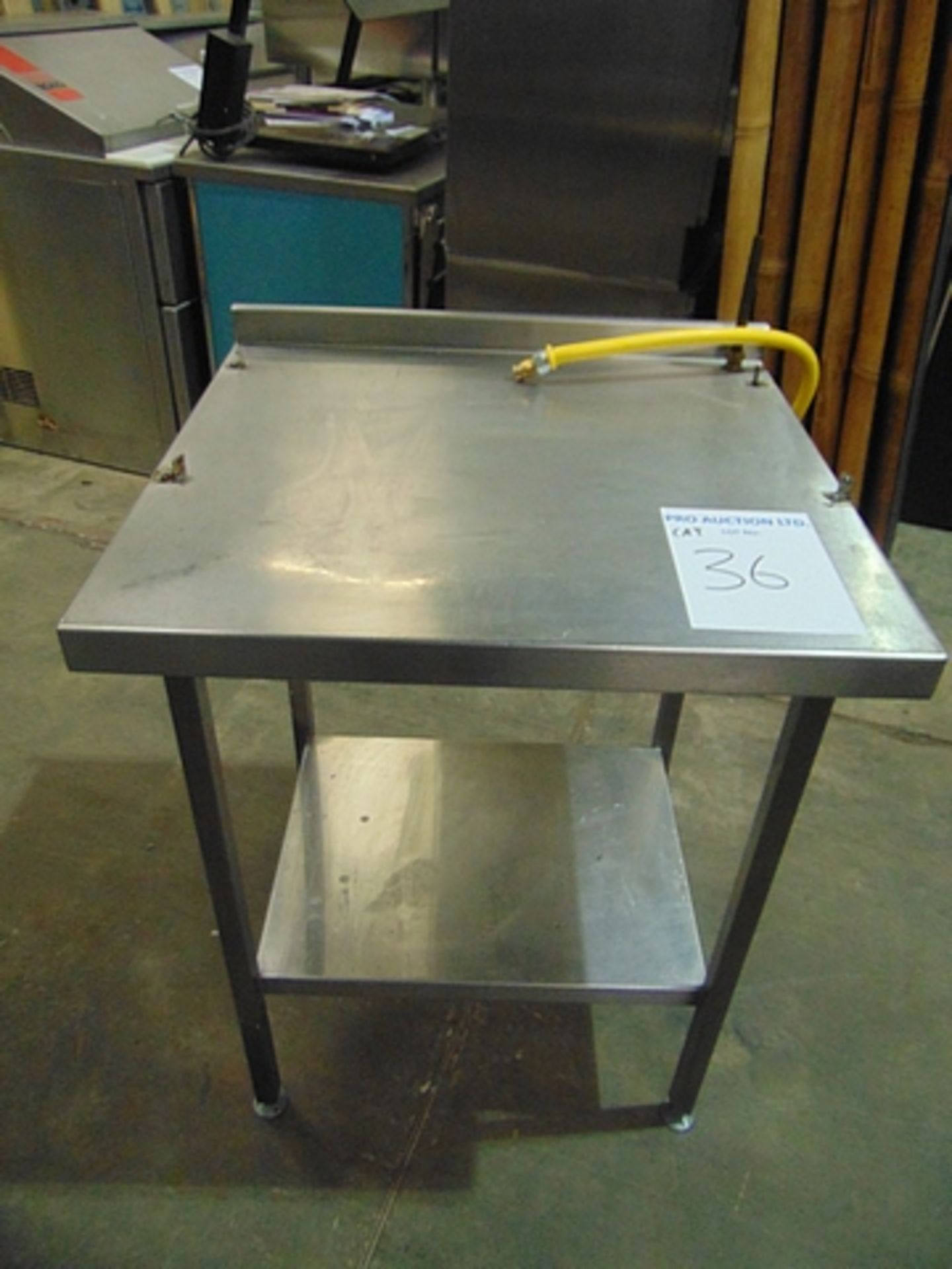 Stainless steel table with back splash and under shelf 750mm x 700mm x 970mm